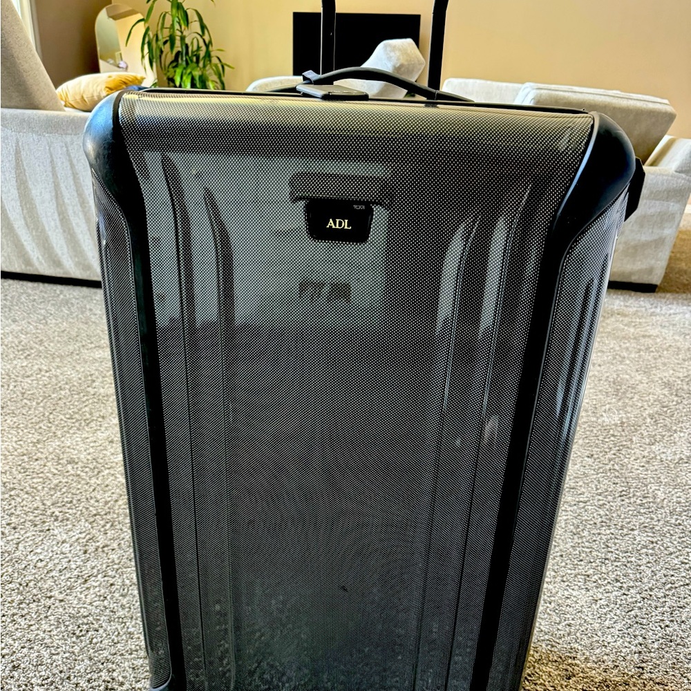 TUMI checked bag!